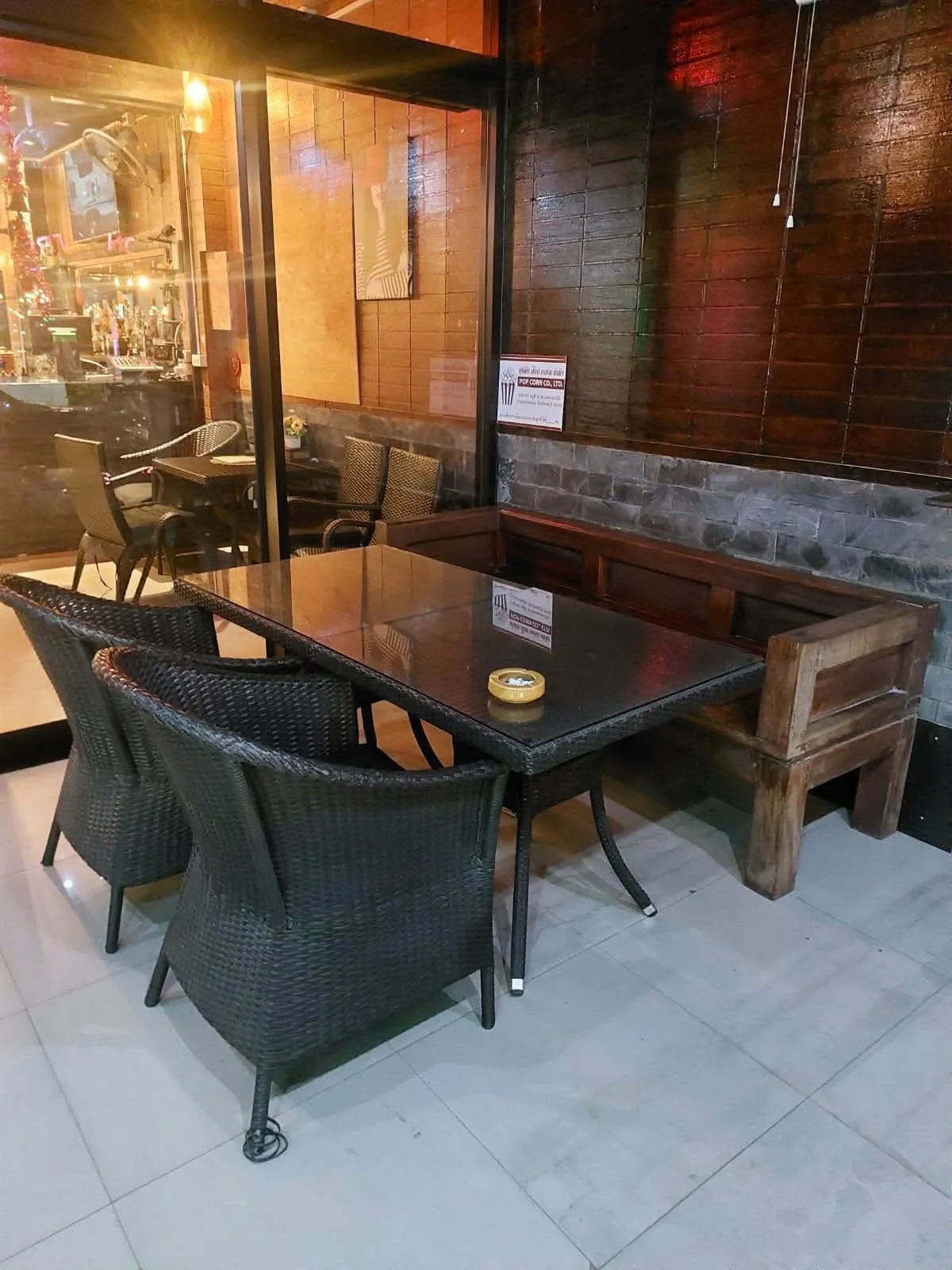 Table and chairs in the bar, wood-panelled wall behind