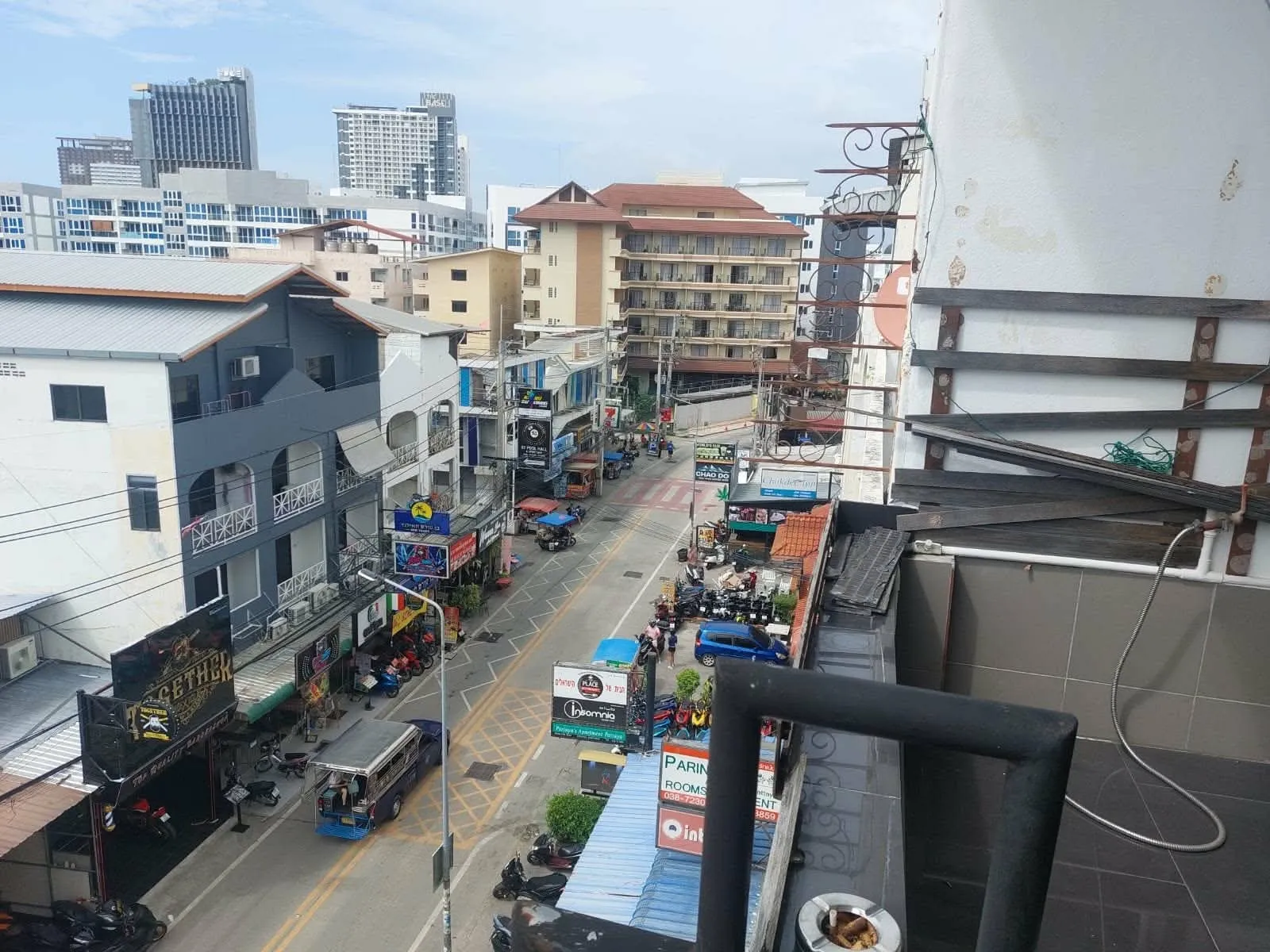 Soi Buakhao in daylight seen from the property, shops and traffic below
