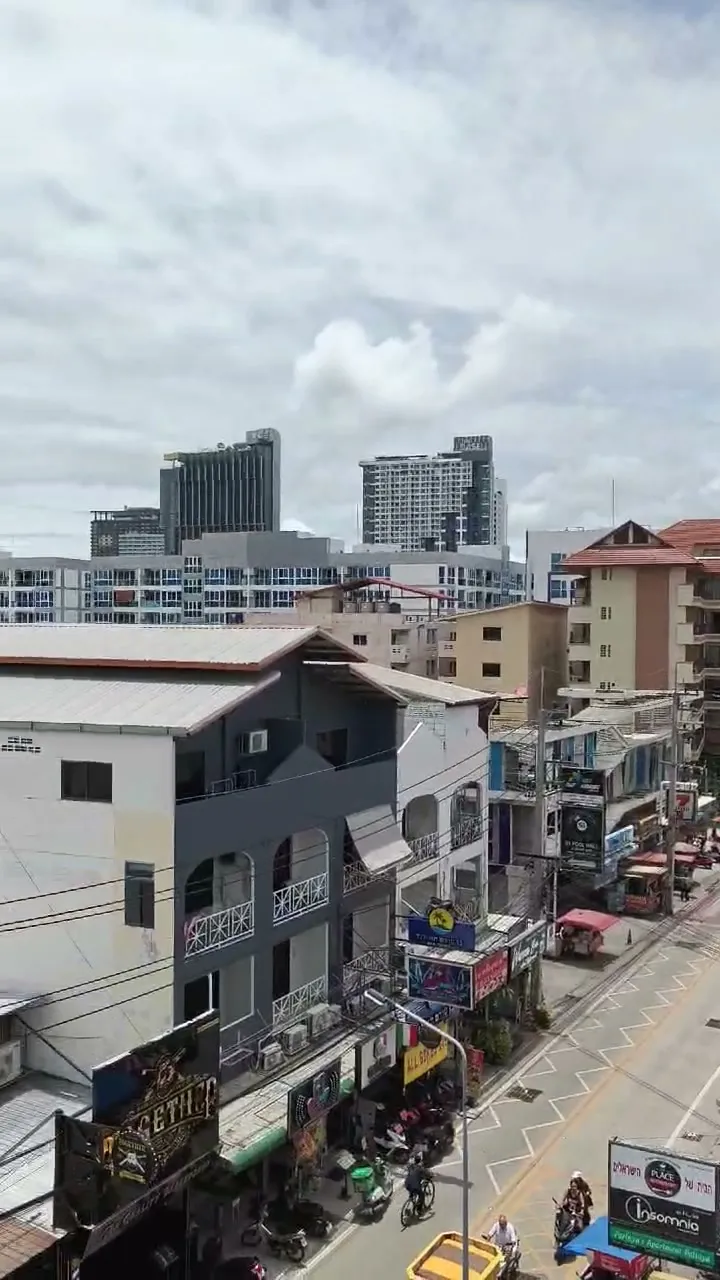 Wide view over Soi Buakhao and the rooftops from the suite balcony